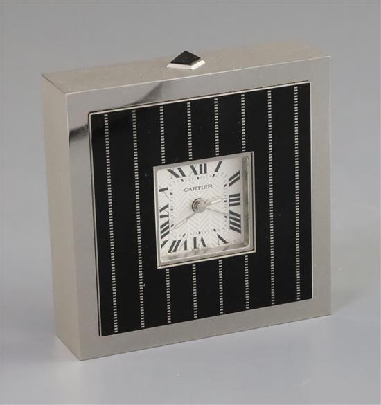 A Cartier black enamel and steel cased timepiece, height 3.75in.